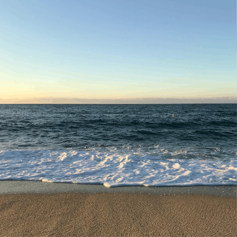 Sink your feet into the sand at Port de Pollença beach, just 1.7km away