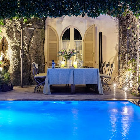Gather on the terrace for candlelit dinners by the pool