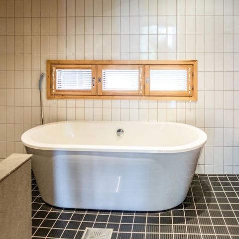 Treat yourself to a long, luxurious soak in the free-standing bathtub