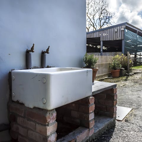 Clean up mucky pups after long walks in the countryside at the outdoor sink