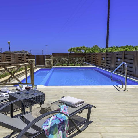 Laze on sun loungers before cooling off in your own swimming pool