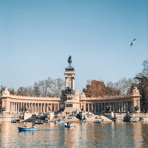 Stroll around El Retiro Park, stopping off at the Great Pond for a row