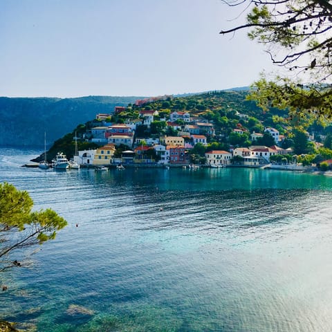Stroll around Assos harbour, with a visit to the beach a must