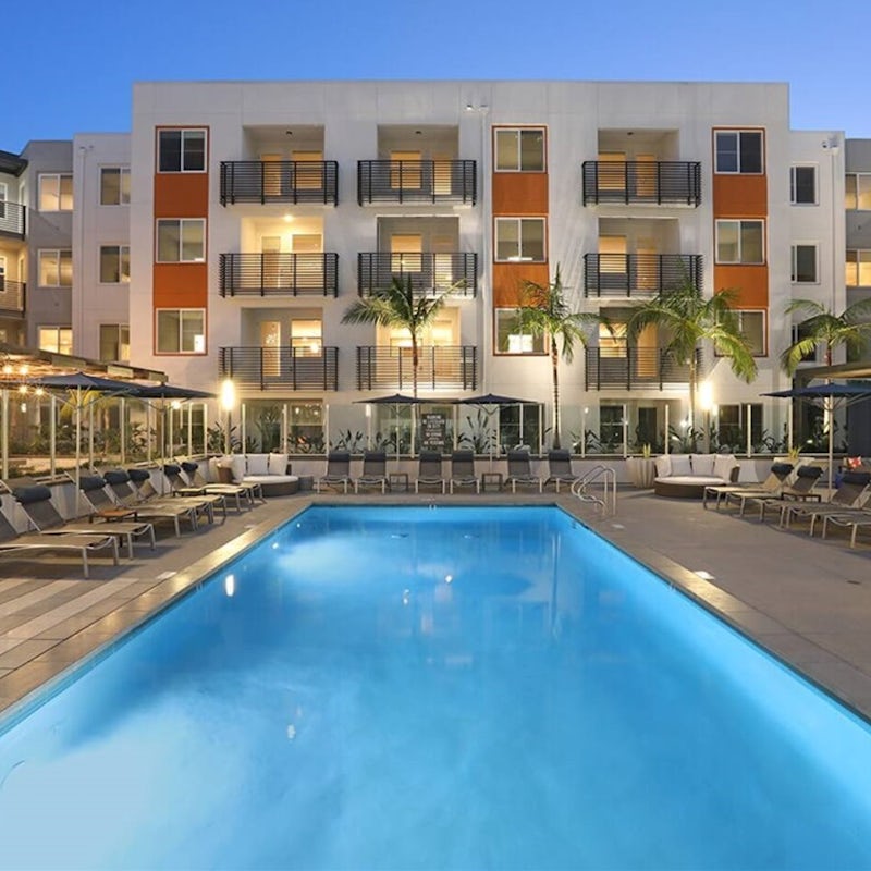 Dive into the inviting waters of the building's pool
