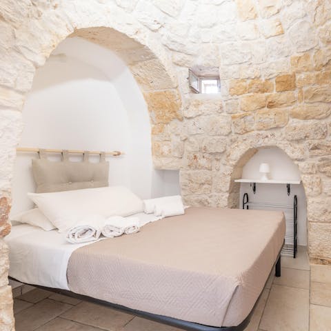 Wake in your charming bedroom, surrounded by beautiful stone