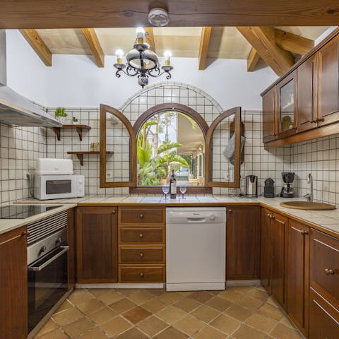 Enjoy the leafy views through the unique window while cooking up Spanish sausages in the kitchen