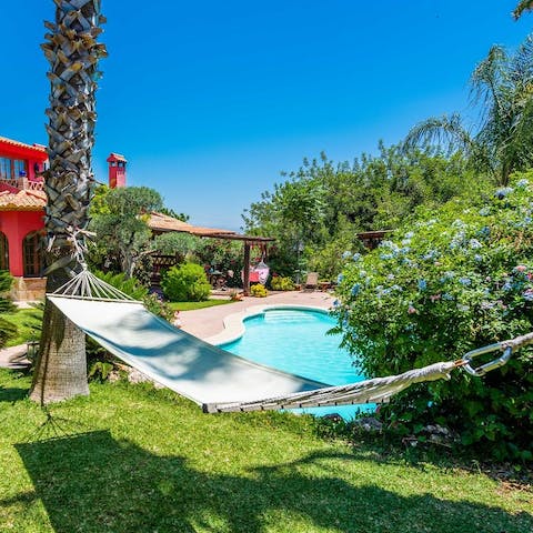 Kick back and relax on the poolside hammock