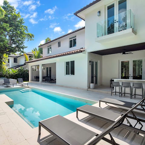 Soak up the South Florida sunshine from in or beside the private pool