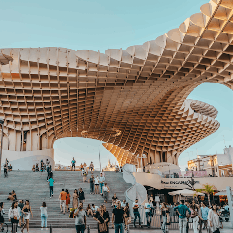 Visit the striking Setas de Sevilla, a fourteen-minute walk away