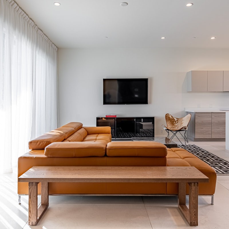 Kick back and relax after a hike through the desert on the orange-coloured sofa