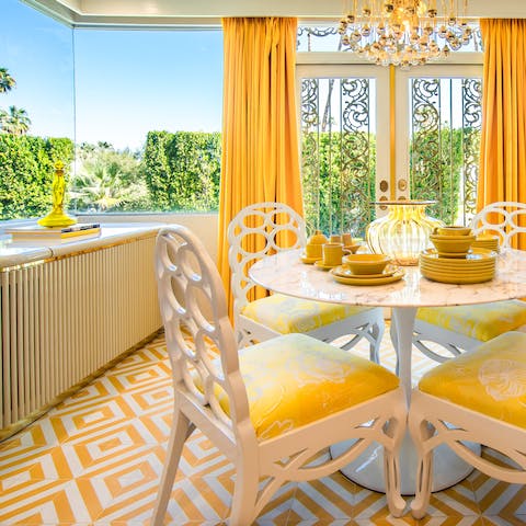 Enjoy views of lush greenery and blue skies in the sunny second dining space