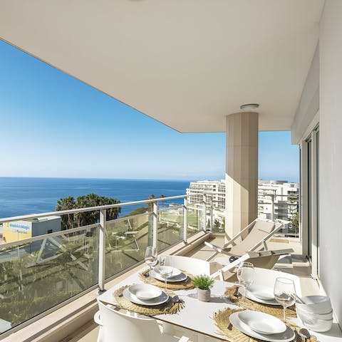 Dine alfresco as the Atlantic Ocean stretches out before you