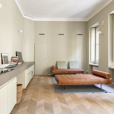 Relax in the chicly minimalist living area, a glass of Italian wine in hand