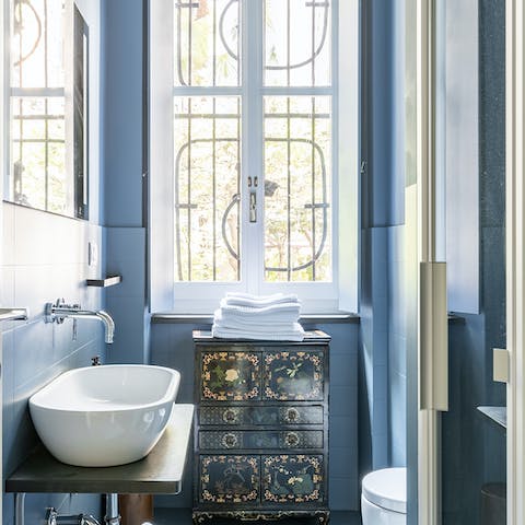 Pamper yourself in the luxurious blue bathroom