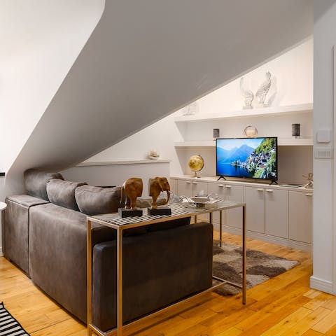 Kick back and relax in the cosy living space, complete with a smart TV and in-ceiling speakers