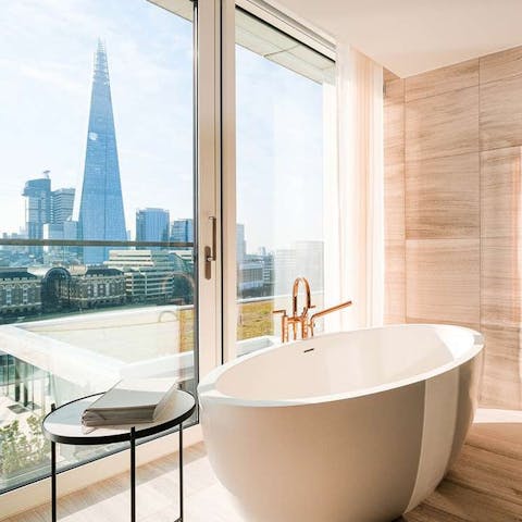 Relax with a long soak in the free-standing bath overlooking the view