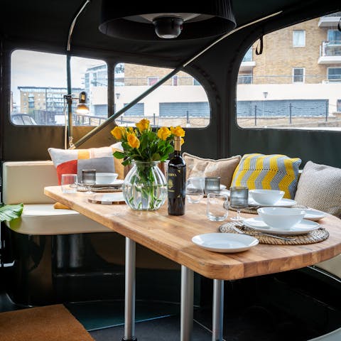 Sip wine and admire Limehouse Marina views from the stern