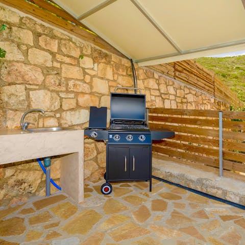 Show off your culinary gifts in the covered outdoor kitchen