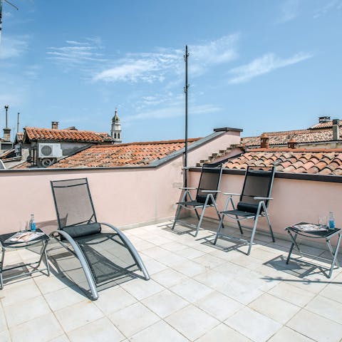 Soak up some sun on your private rooftop terrace
