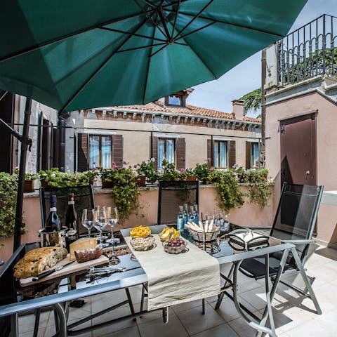 Enjoy an alfresco breakfast on your communal patio 