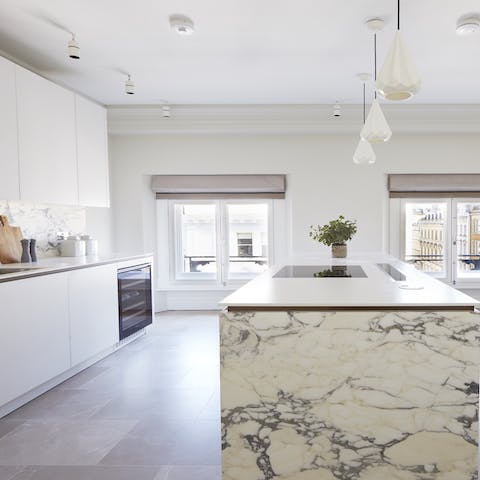 Plate up home-cooking perfection in the stunning marble island kitchen