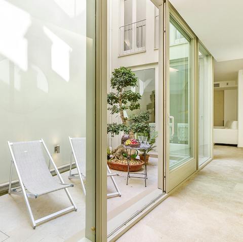 Sit in the luxurious glass atrium in the centre of the house with a good book, or use the space to securely store bicycles