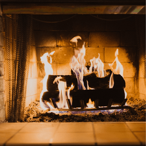 Spend evening snuggled up beside the warm glow of the fireplace