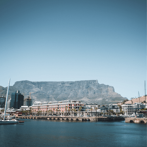 Peruse the upscale boutiques along the V&A Waterfront, a short walk away