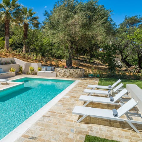 Soak up the Greek sun in or beside the private pool