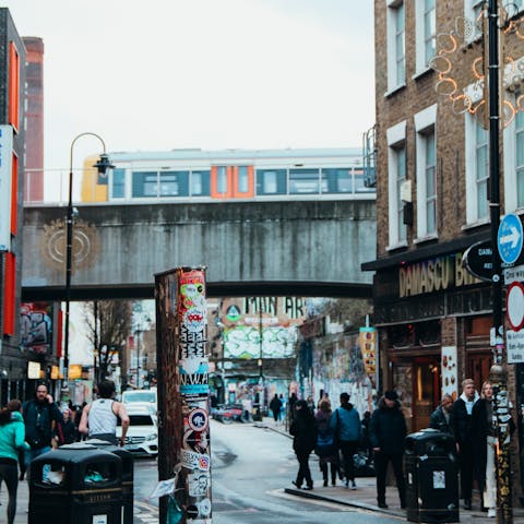 Explore the street art and buzzy restaurants in local Shoreditch