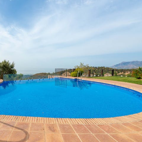 Cool off in the shared infinity pool with a view
