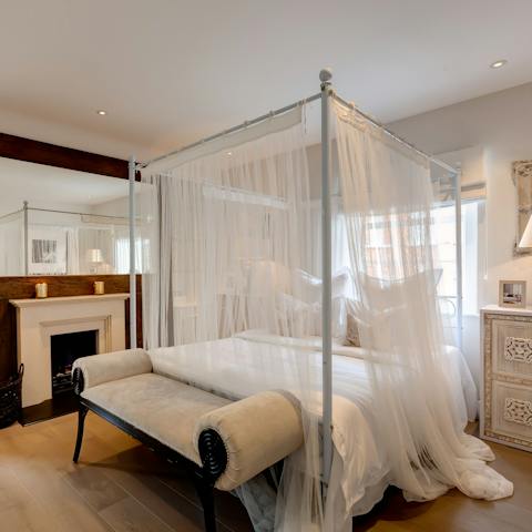 Sleep like royalty in the elegant four-poster bed