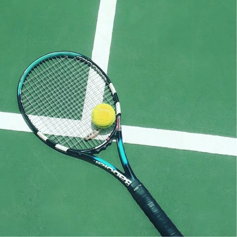 Head to the communal court for a few games of tennis