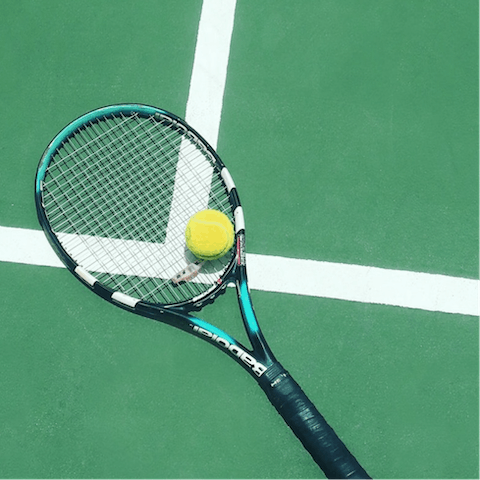 Head to the communal court for a few games of tennis