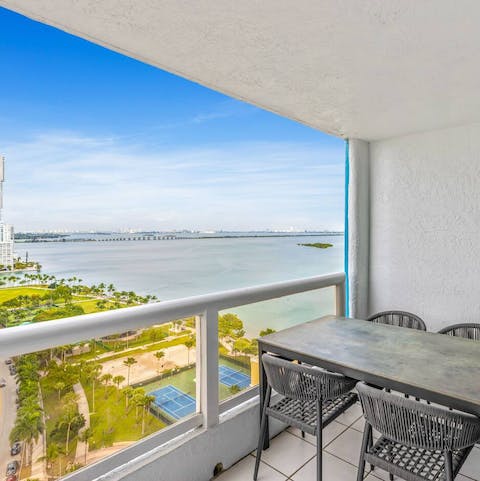 Admire the views over Biscayne Bay from your private balcony