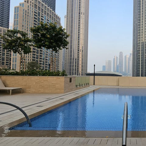 Swim in the communal pool to beat the Dubai heat