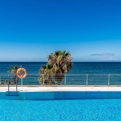 Plunge into the communal swimming pool to escape the Spanish heat