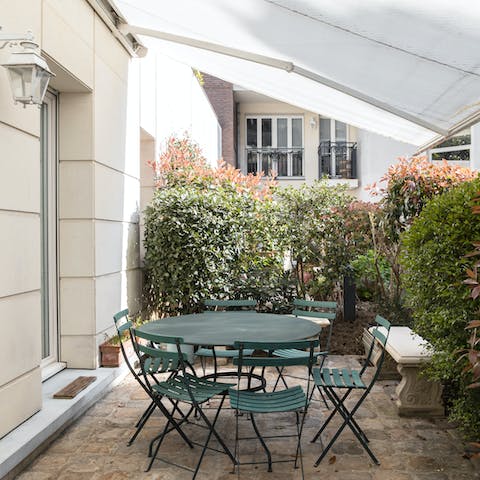 Enjoy fresh coffee and croissants each morning in the courtyard garden