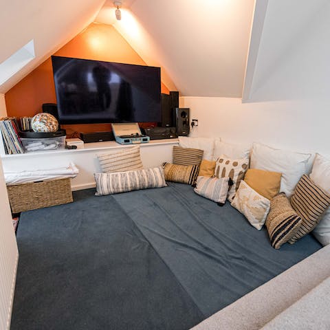 Let the kids laze away in the cosy cinema snug