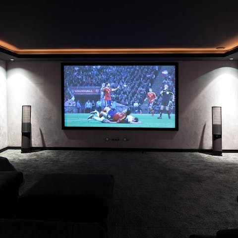 Catch a game or watch movies in the home cinema room