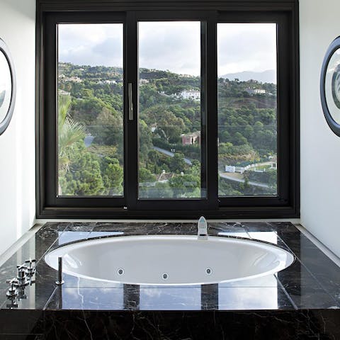 Start the day with a relaxing Jacuzzi bath while you admire the views