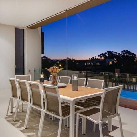 Enjoy a spot of alfresco dining with loved ones as the sea breeze ruffles your hair