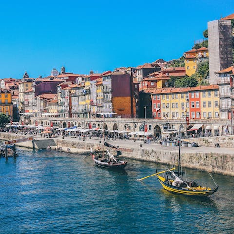 Walk along the Cais da Ribeira promenade on the banks of the Douro, a five-minute stroll away