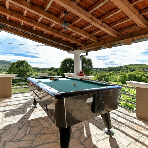 Play a few games of billiards on the terrace