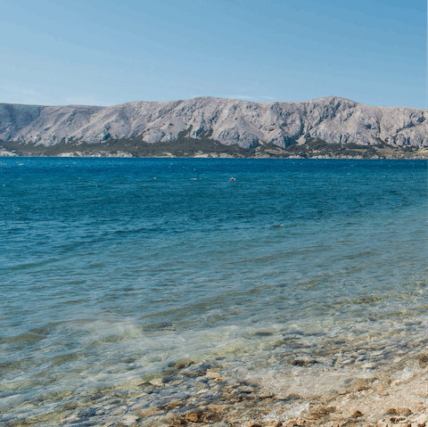 Swim the crystal clear waters of Meka Draga, just 8 km away