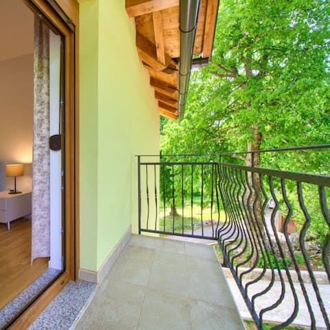 Bag a bedroom with a private balcony and look out over the trees