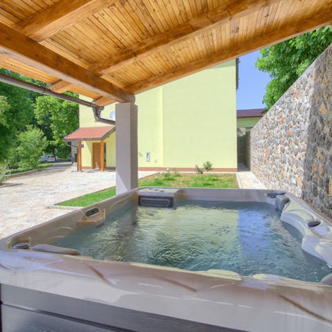 Slip into the bubbling hot tub to unwind at the end of the day