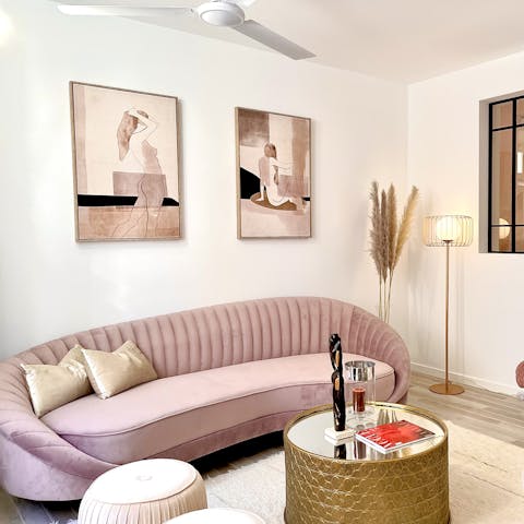Uncork a bottle of Albariño and enjoy a fabulous night in on the chic pink sofa 