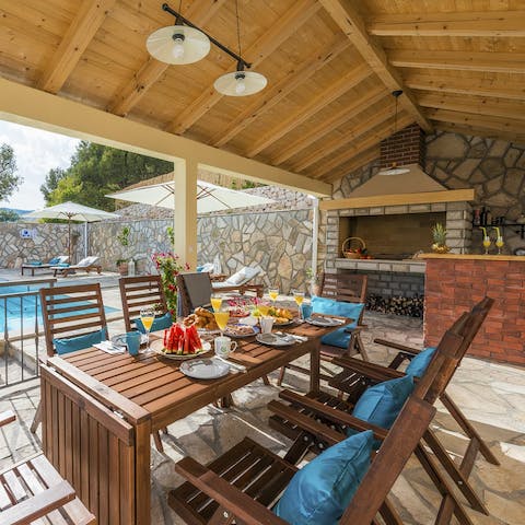 Fire up the built-in barbecue and dine on the covered terrace
