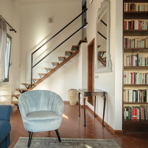 Pick a title from the bookcase and curl up in the cosy living room